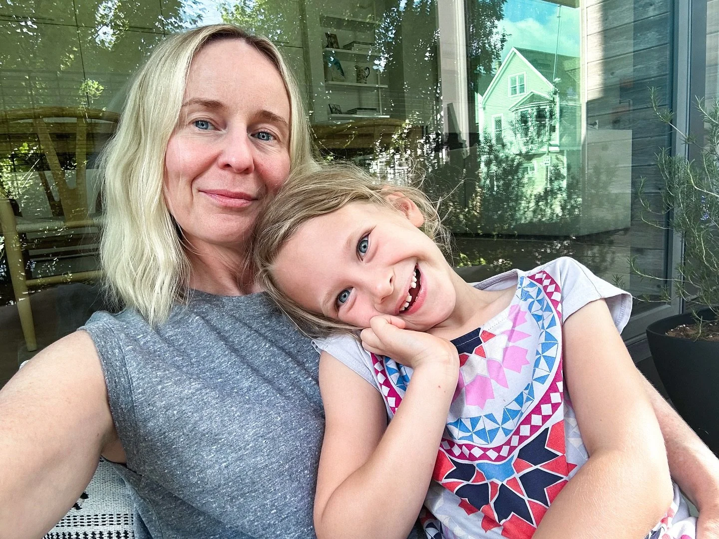 Me and Willa mugging in a selfie. I treasure that she still sits on my lap and does this with me.