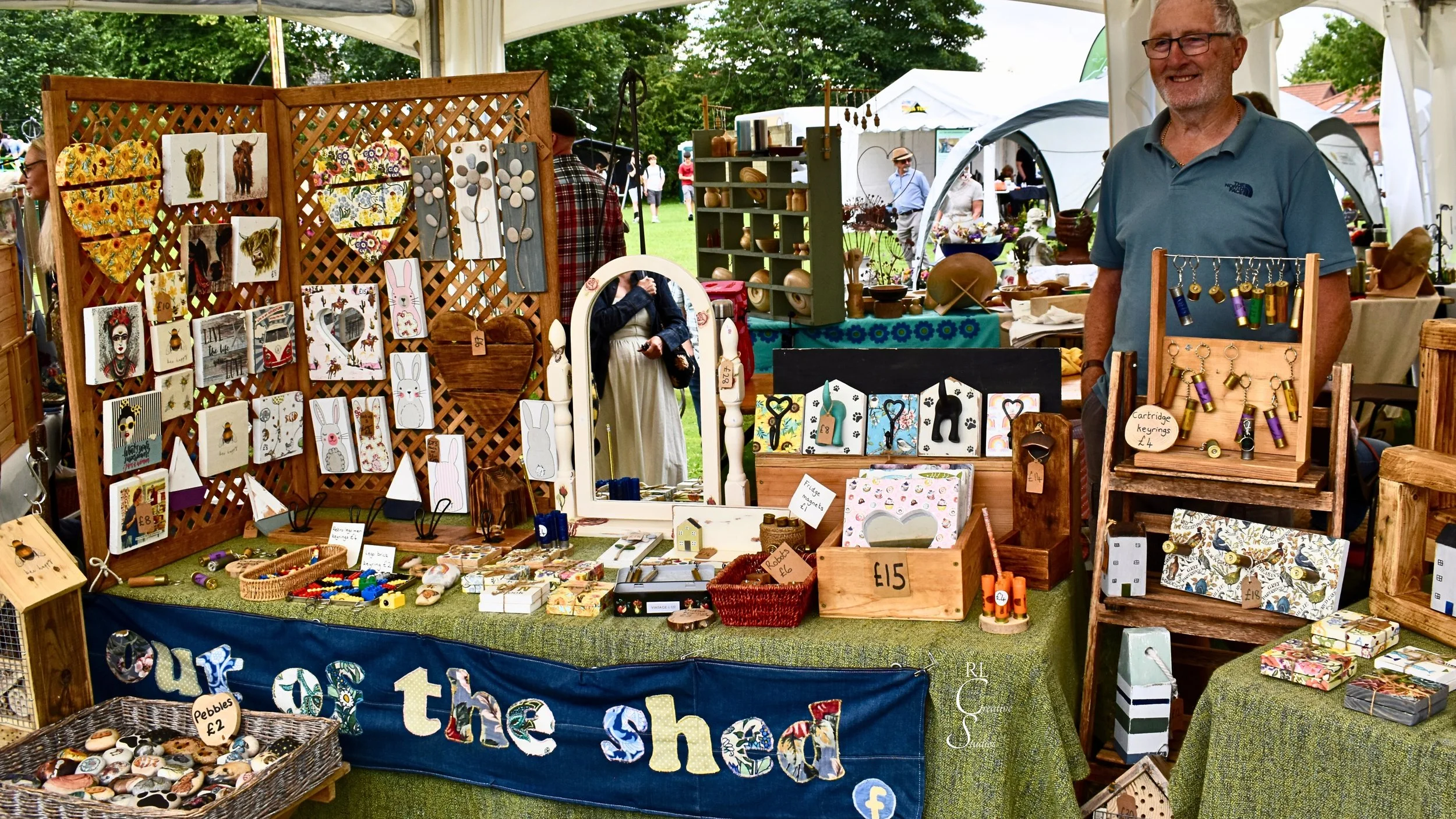 Out of the Shed stall, with lots of handmade wooden items on display.