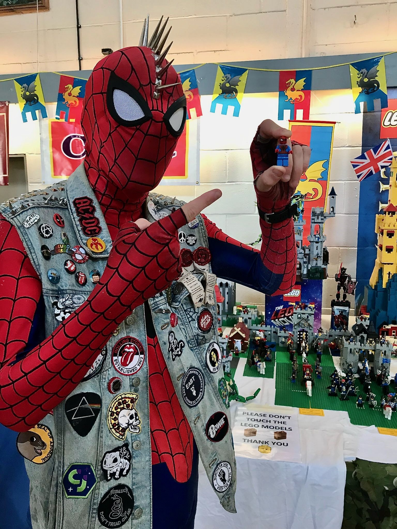 Spider-Man holding a Lego piece