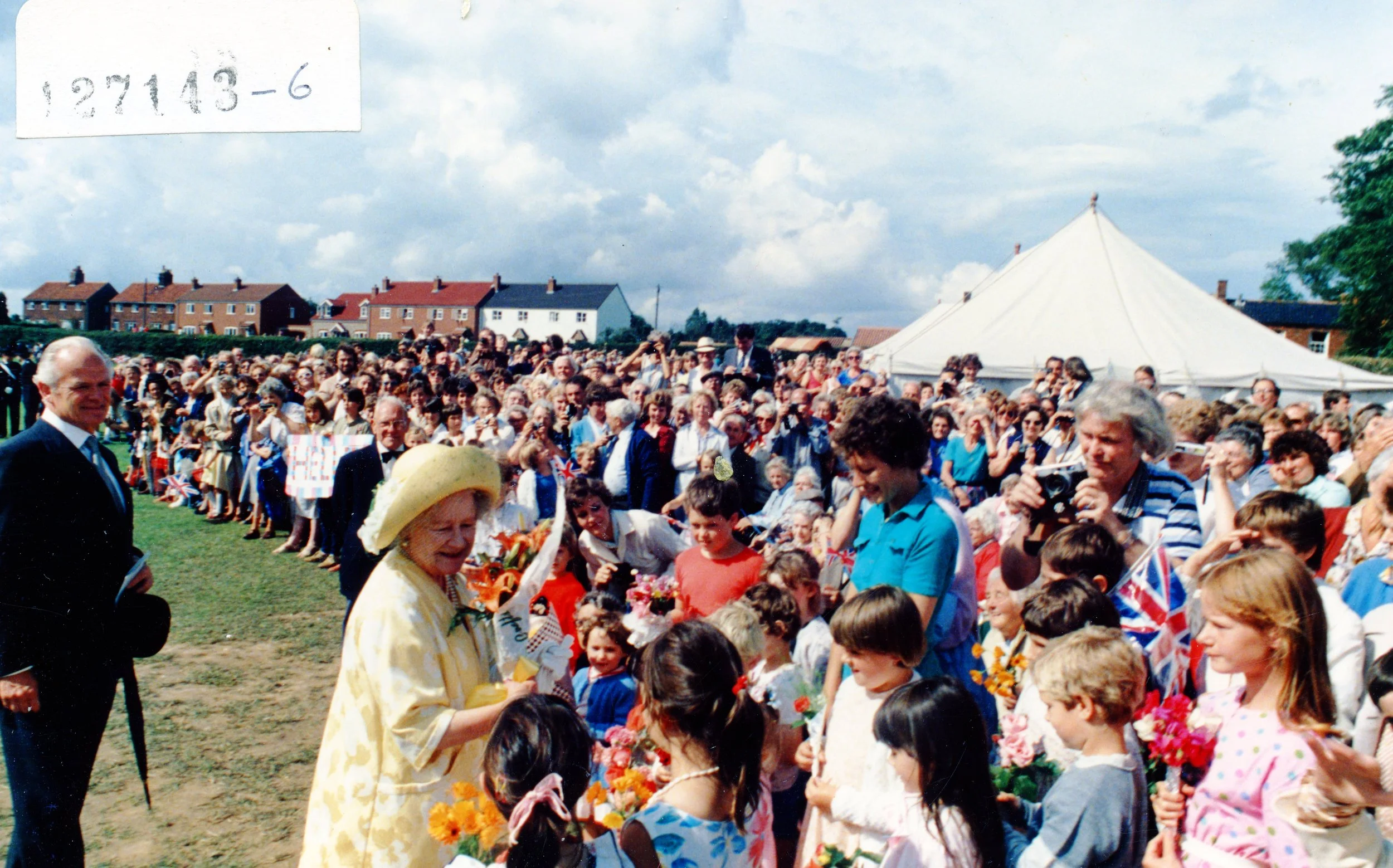 1985 the Queen's Mother visited the Worstead Festival, and is featured welcoming crowds of people.
