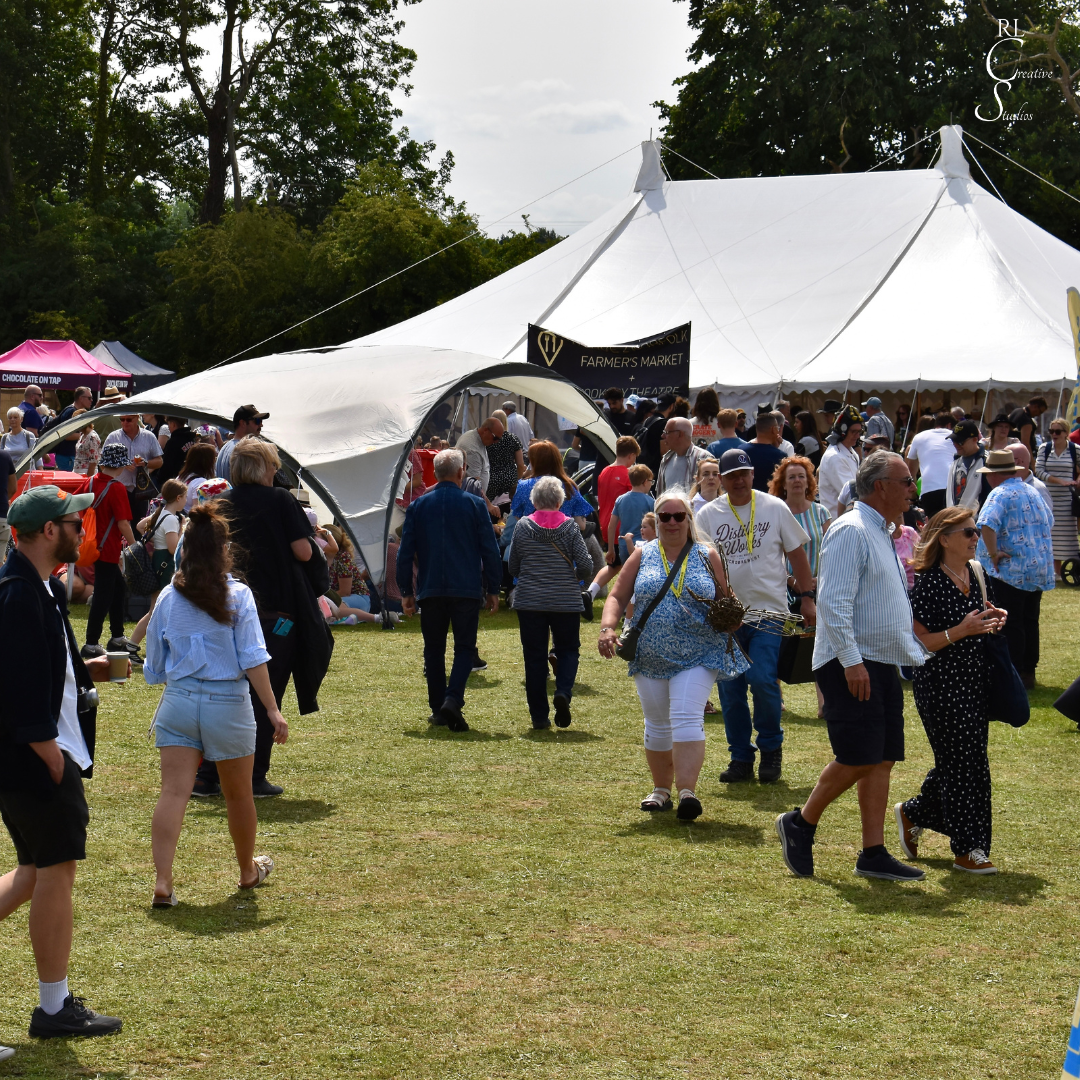 Crowds of people walking around the festival