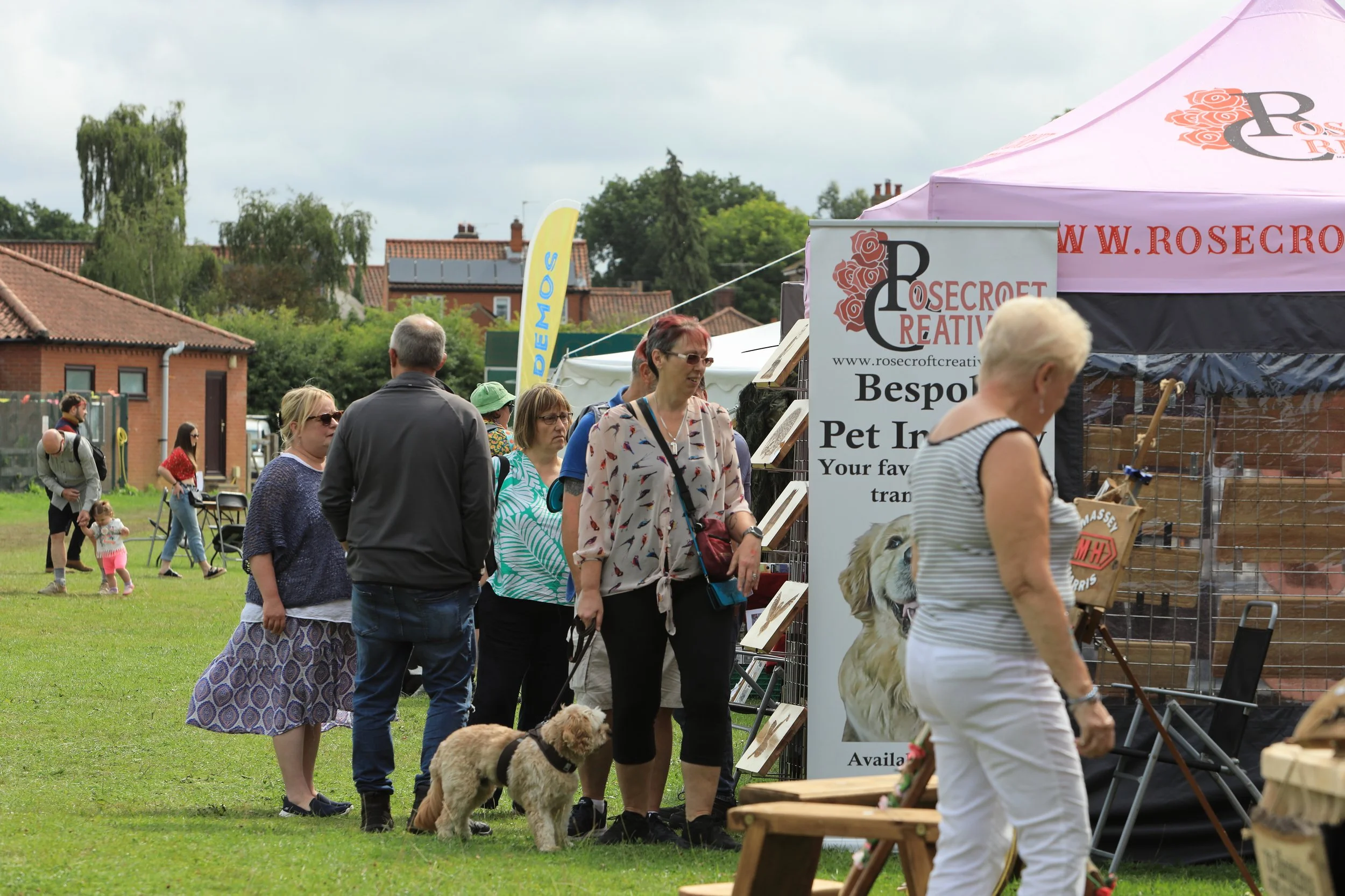 Public looking around the Rosecroft Creative pitch, and others down this aisle