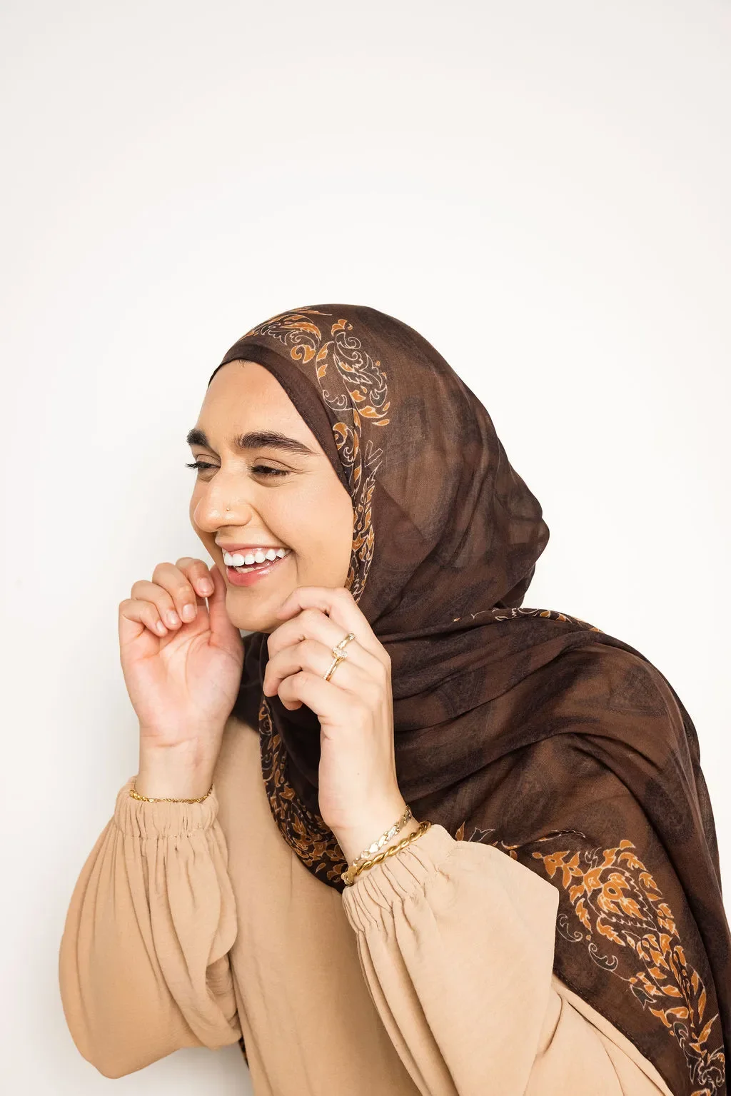 Hajrah Javed, a mental health therapist in Arlington Texas smiling for her headshots