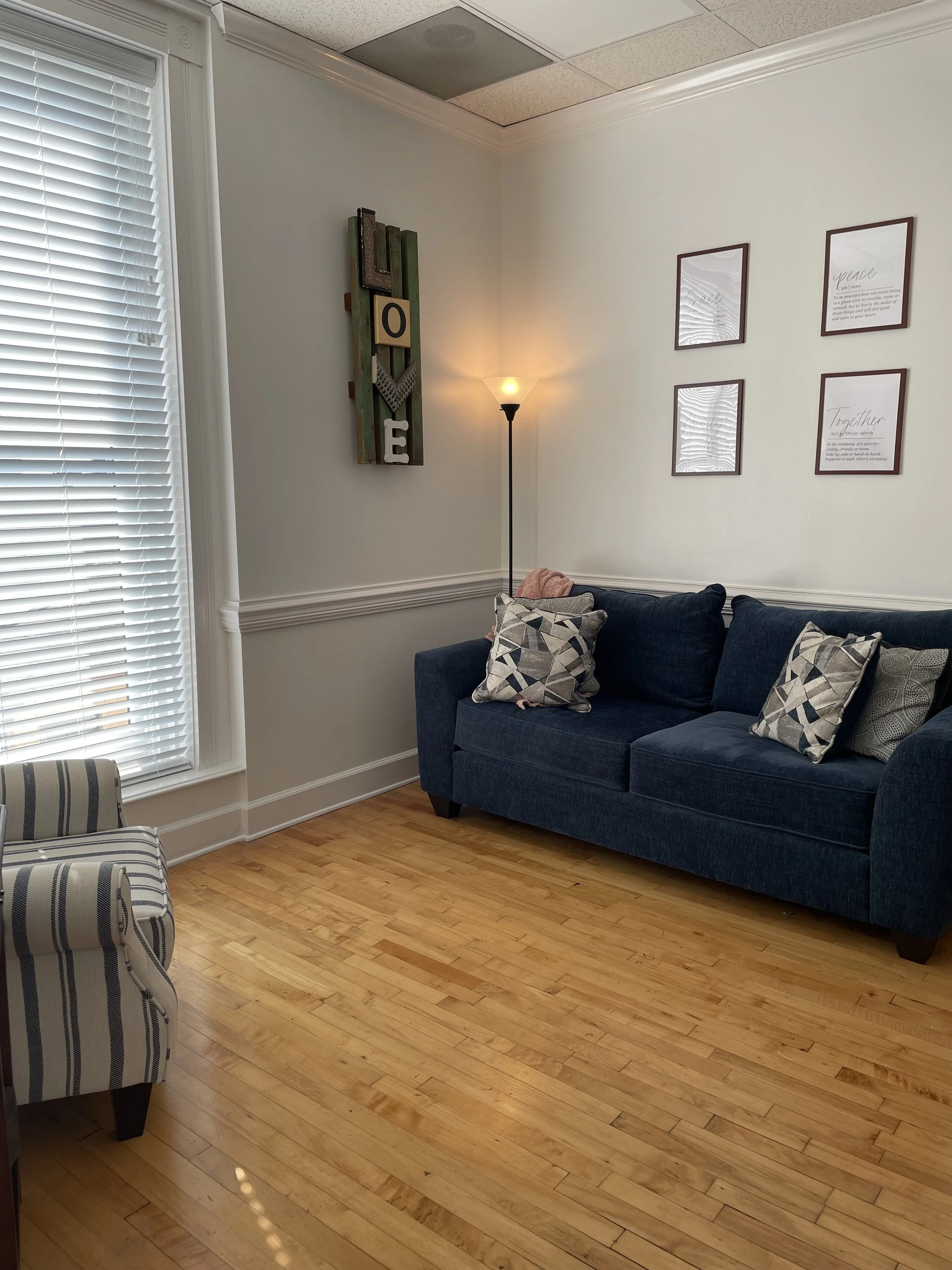 Counseling room, blue couch and striped chair