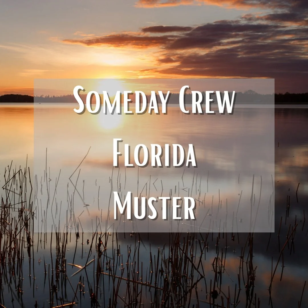 Sunset over a calm lake with reeds in the foreground and a cloudy sky in Florida.