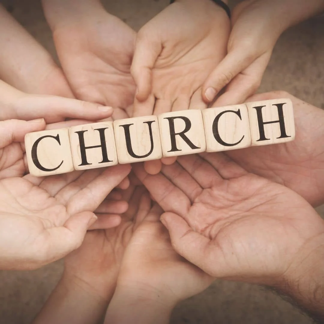 hands surrounding the word church