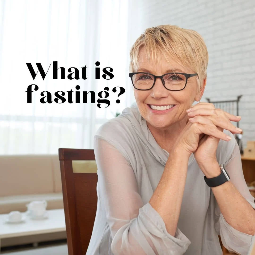 older Christian lady sitting at her table with hands folded and smiling