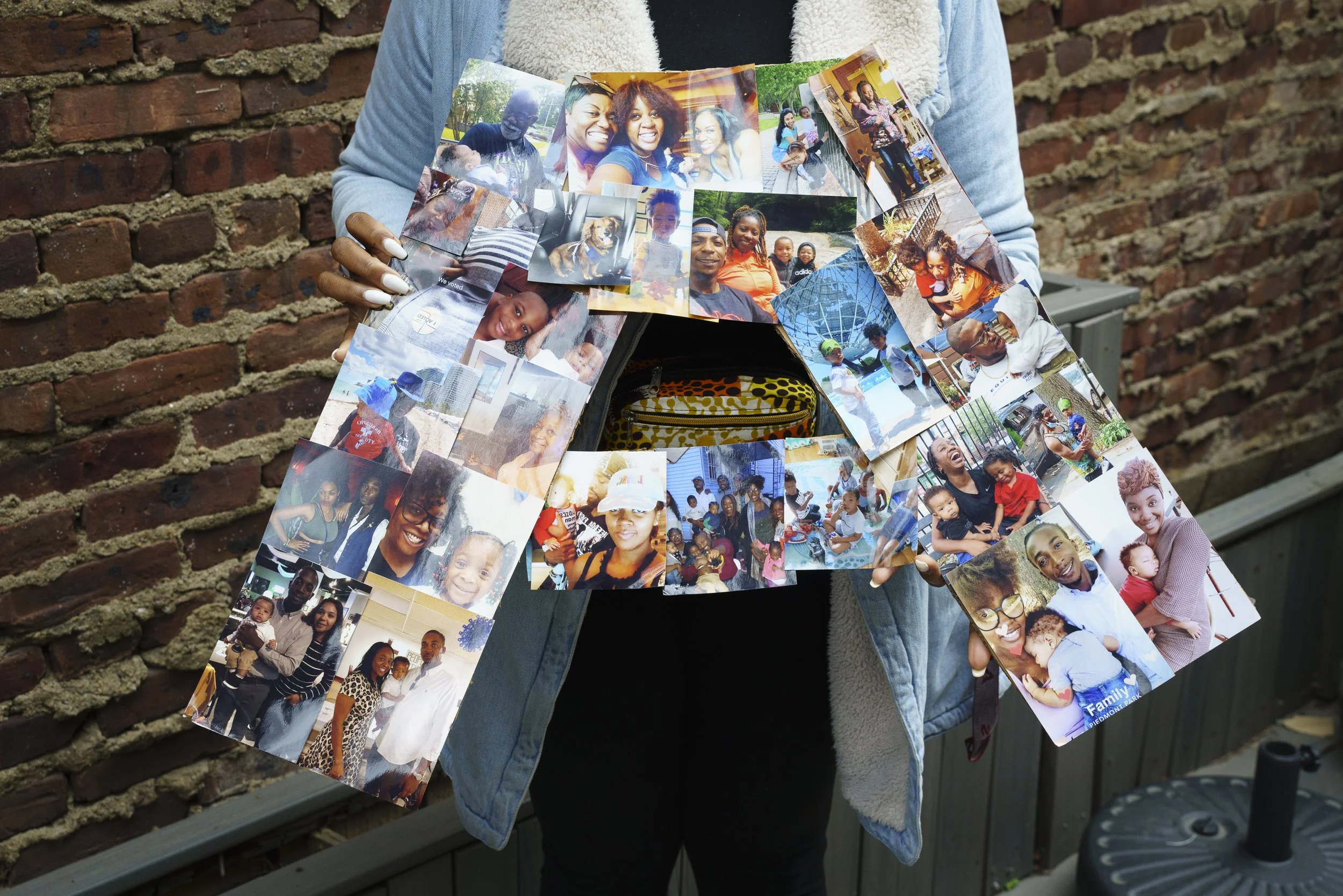  Korede Amole holds art created by her son Amari, a student in Little Sun People’s Zulu Fouriors class on April 5, 2022. Amole says the collage made her feel connected to Amari in his school environment when it was hung in his classroom during the pr