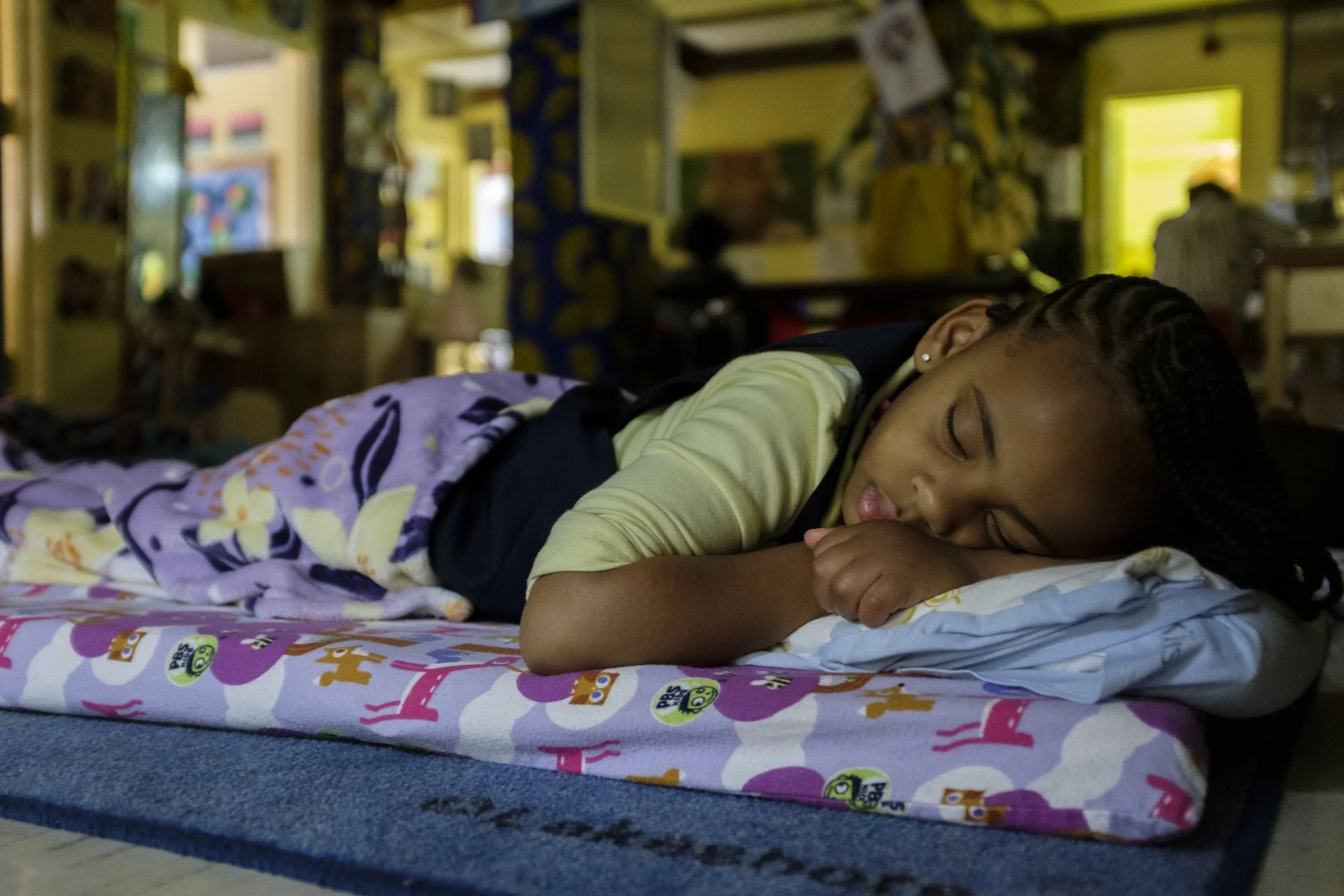  A Little Sun People student sleeps during nap time at the school on May 17, 2021. ©Henry Danner, 2022,  All Rights Reserved  