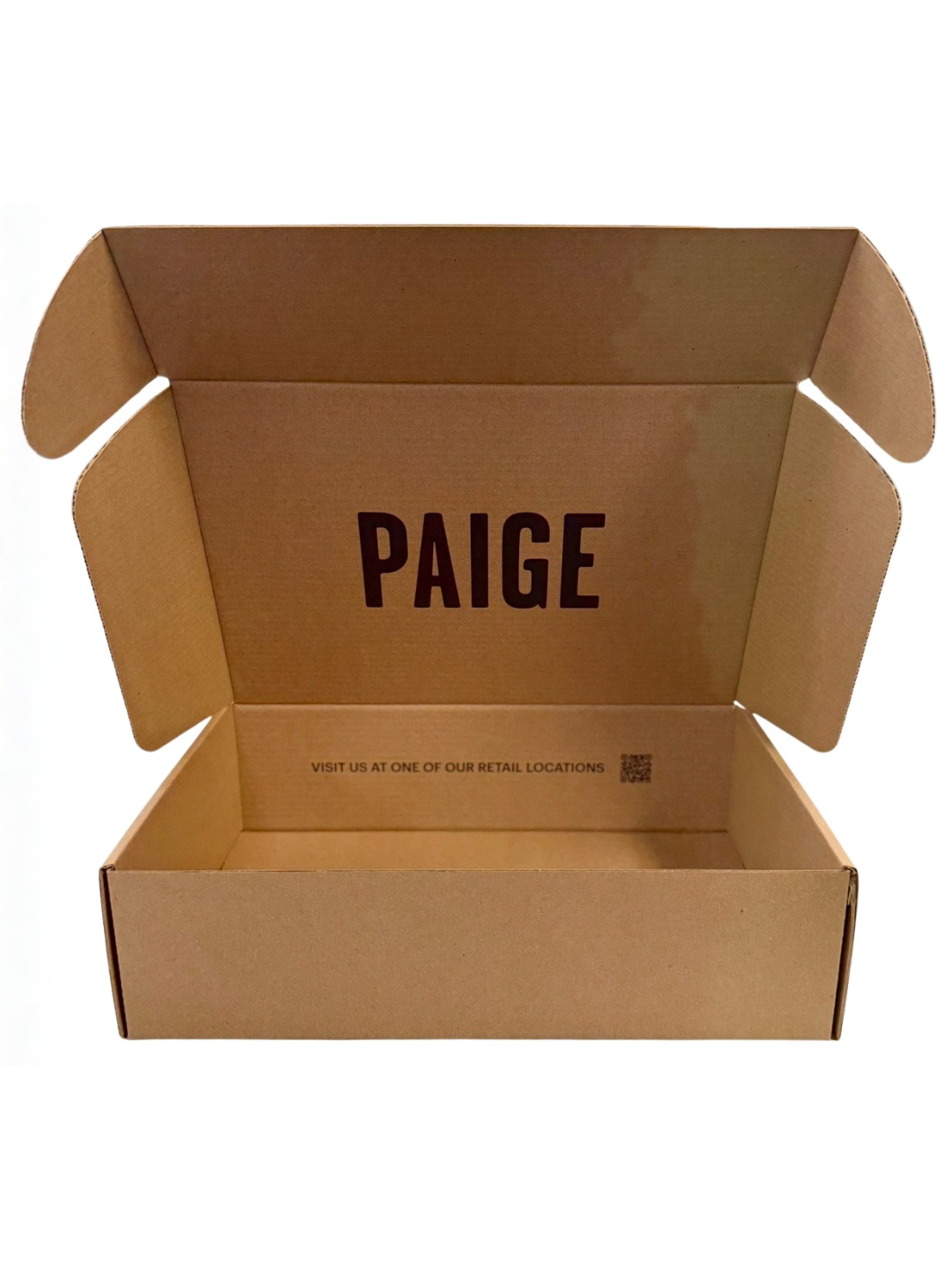 Open cardboard box with the name 'PAIGE' printed inside and a message about visiting retail locations.