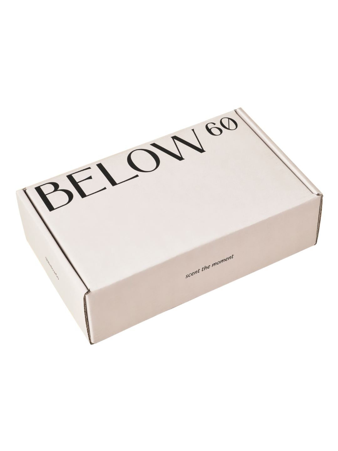 A white rectangular box with black text reading 'BELLOW 60' and a slogan 'scent the moment' on its side.