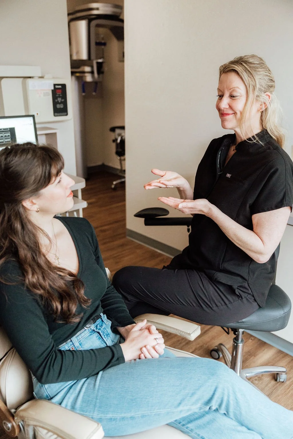 Our hygienist, Gina, catching up with a patient in our Inhale Suite, prior to beginning some pre-procedure breathwork.