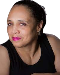 Close-up of a woman with short hair, wearing a black top, looking directly at the camera with a confident expression.