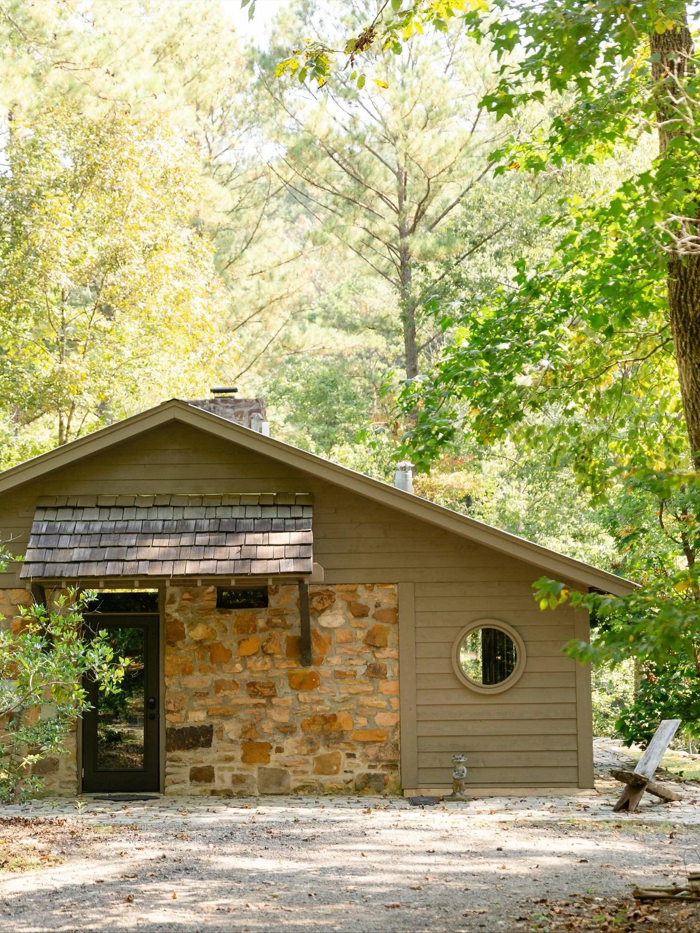 Welcome to The Rock Cabin. Tucked in the middle of the woods, what was once essentially a screened-in porch built in the 40s (that was then closed in with glass sliding doors several decades ago to keep critters out) is now a cozy one-room cabin that