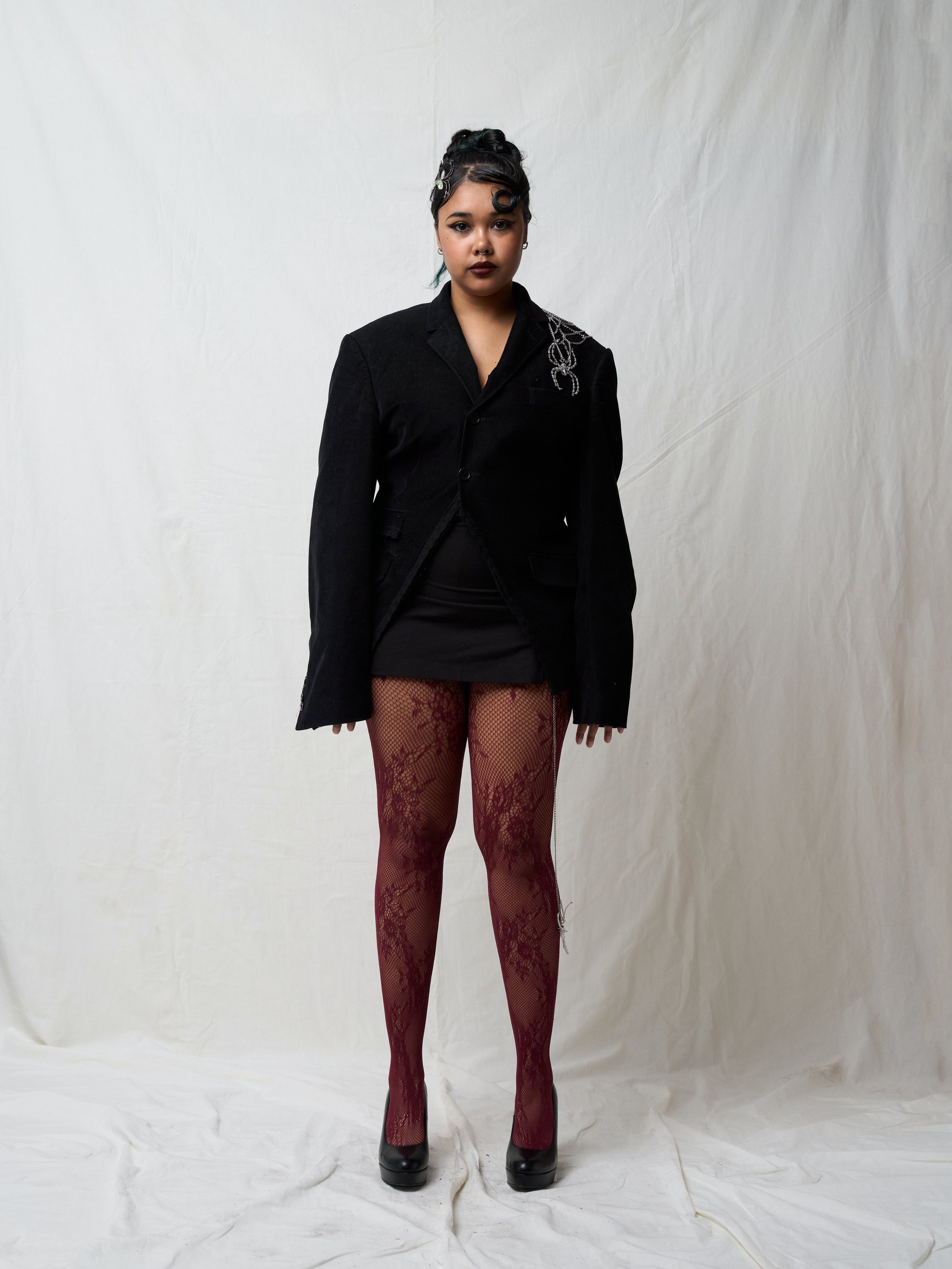 One Way! Or Another! | Jada

Jada&rsquo;s dark feminine blazer is inspired by her fascination with spiders. The creepy but elegant creature is portrayed in the outfit through glass beads and lace trims, resulting in a blend of a dark and witchy, but 