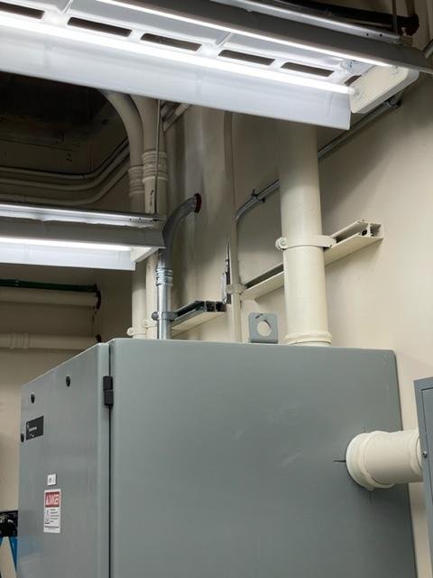 Arb_IT_Finish 2” conduit on top of emergency panel.jpeg