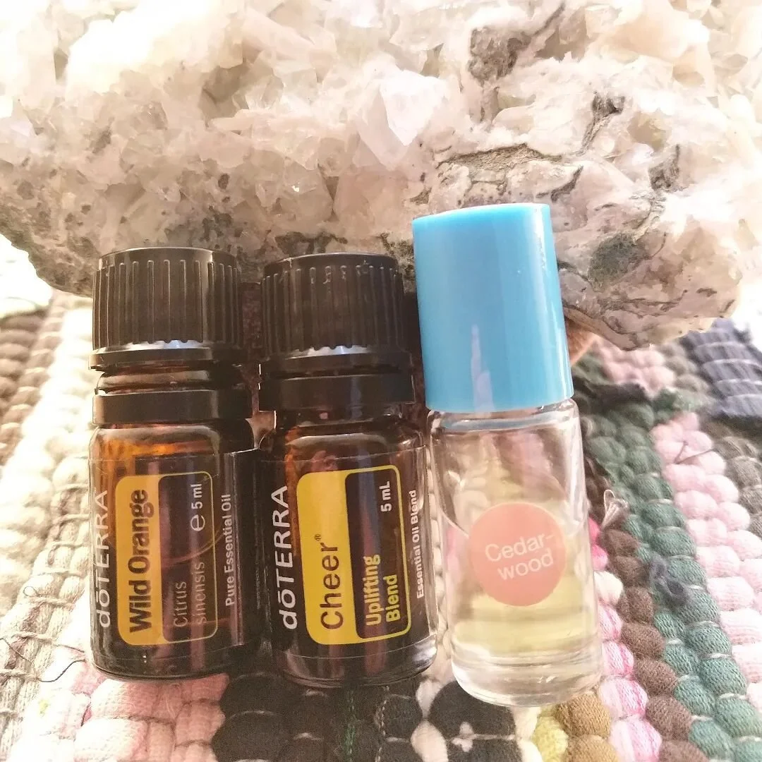 Oils for energising, grounding and emotional support...

 I'm using cedarwood for feeling grounded on my feet with wild orange to help uplift and energise. Cheer in the diffuser with lemon oil to freshen the air and lift the mood. 
What are you using