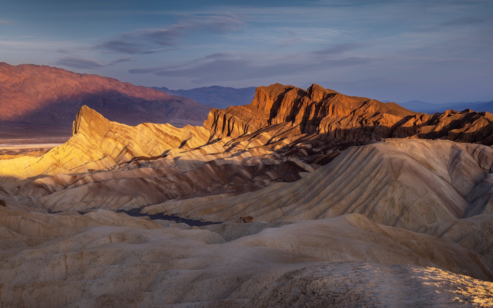 Morning glow off of Zabriskie's Point, Death Valley National Park, you can see most visitors standing on the mound to the right, near the parking lot I hiked a bit and found a quiet place all to myself. #zabriskiepoint #deathvalleynp @tourismcalifor