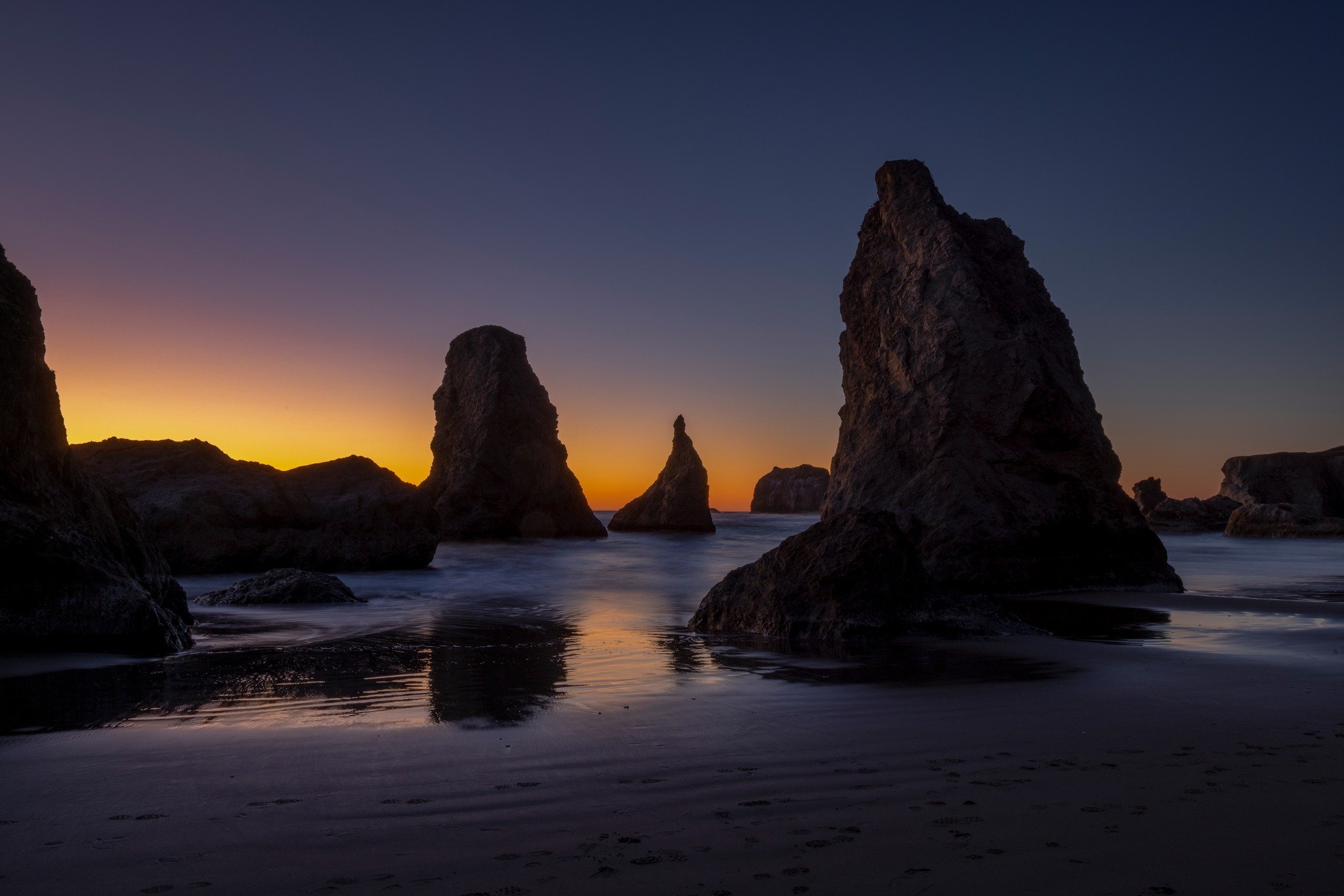 One of my favourite places to visit is the Oregon Coast, there is something magical about the light after the sun sets, that I have not seen anywhere else. This image was taken in Bandon, Oregon, I was all alone on the beach, everyone else had gone h