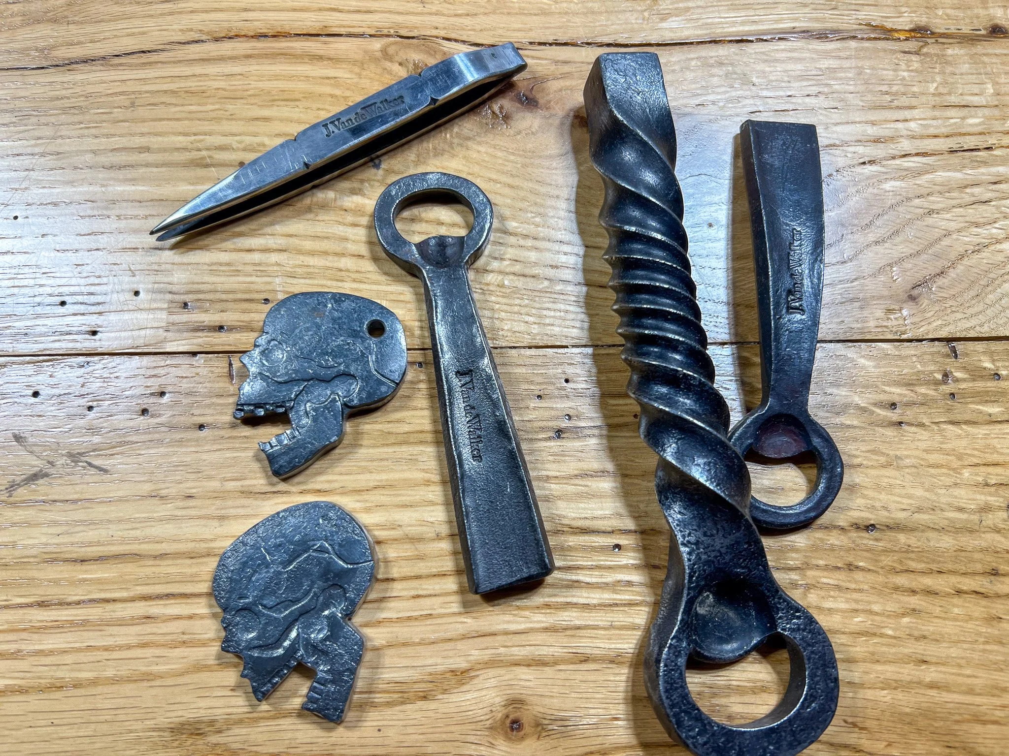 Artisanal Hand-Forged Tweezer and Bottle Opener Collection
