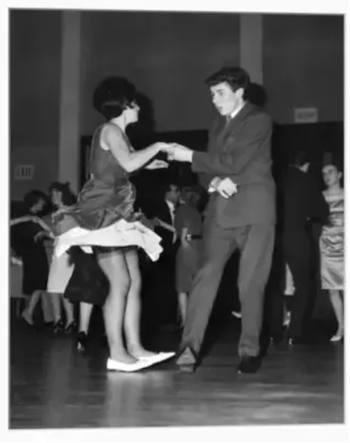 vintage black-and-white photo of a couple swing dancing