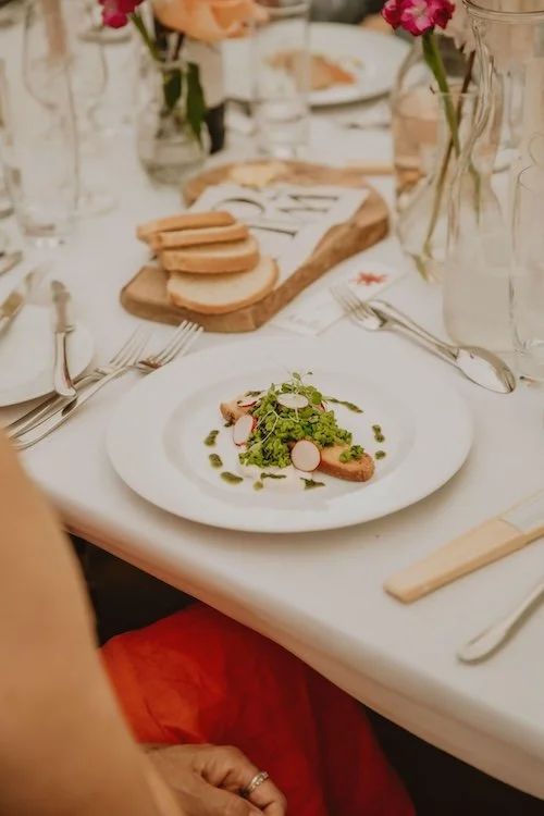 wild fork's colourful smashed pea starter on the table with bread