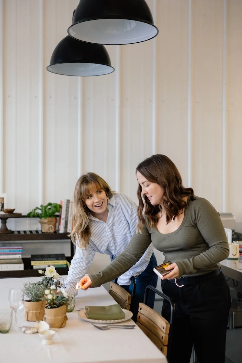 Wild Fork's team laying a table at their kitchen in Bath