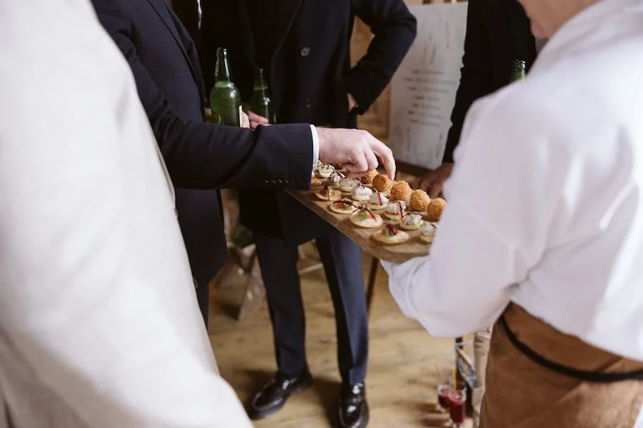 Christmas party guests eating delicious canapés by Wild Fork
