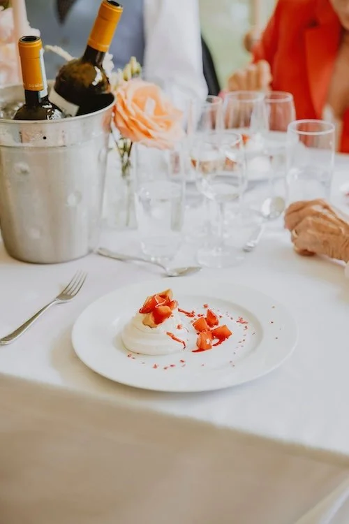 strawberry pavlova on a white plate