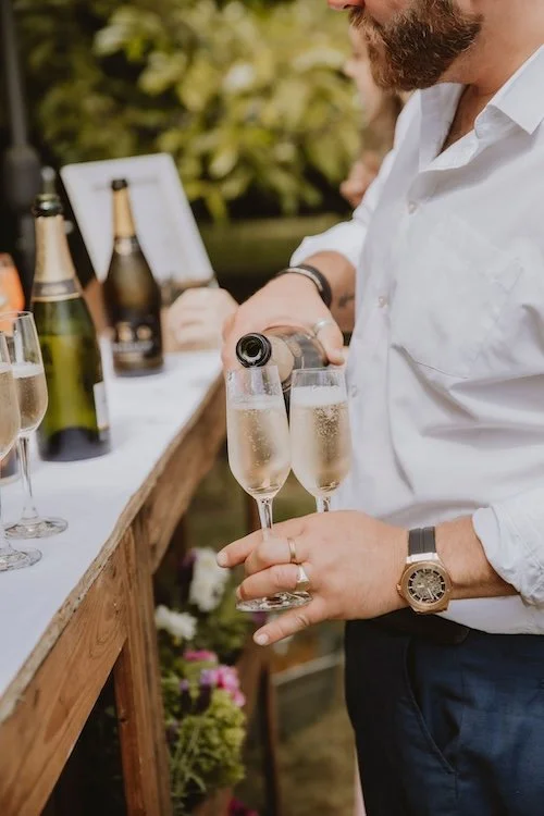 Wild Fork's waiting staff serving a Champagne reception