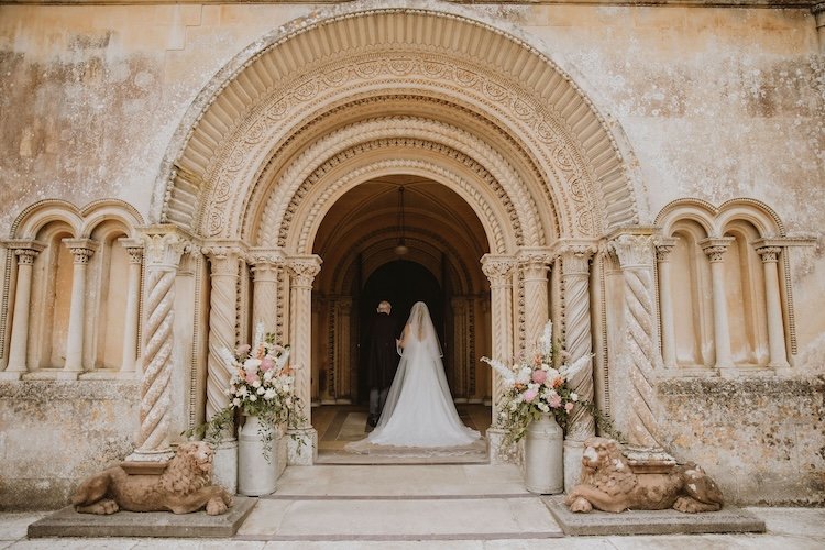 Bride and her father walking into a Wiltshire Church Ceremony
