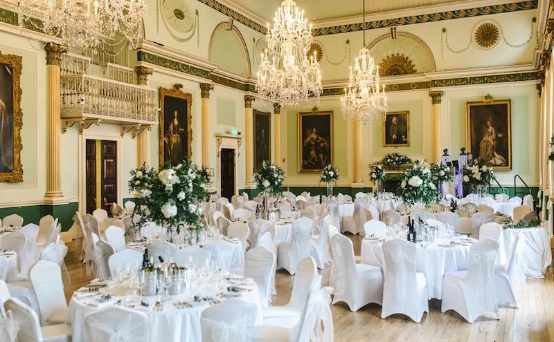 The dining room at Bath Guildhall, dressed for a classic English wedding