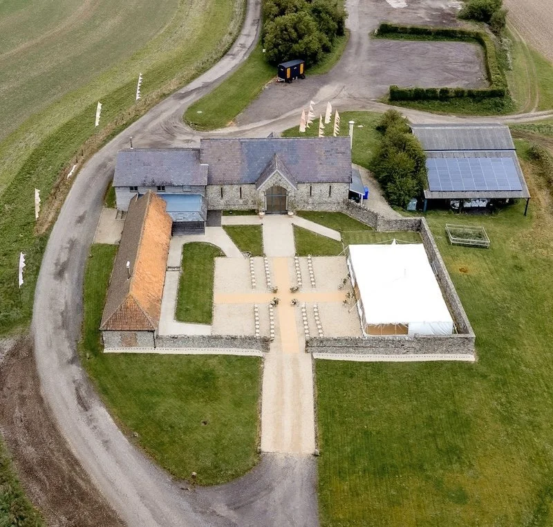 Drone view of Bake Barn wedding venue including a marquee for the ceremony