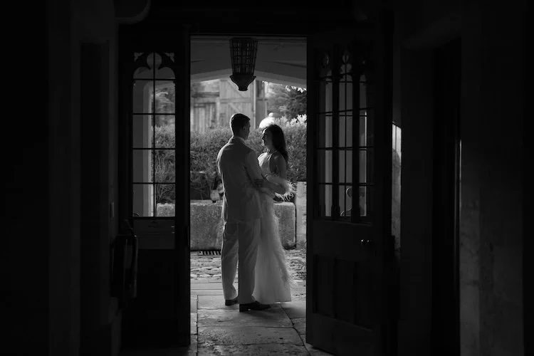 A couple in the doorway of Euridge Manor