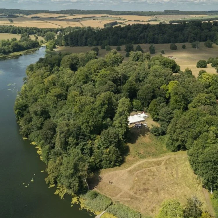 Marquee wedding site on the edge of a lake in Wiltshire