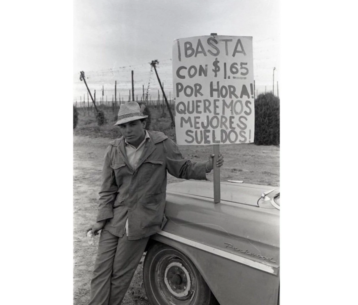   A man holding a sign reading 