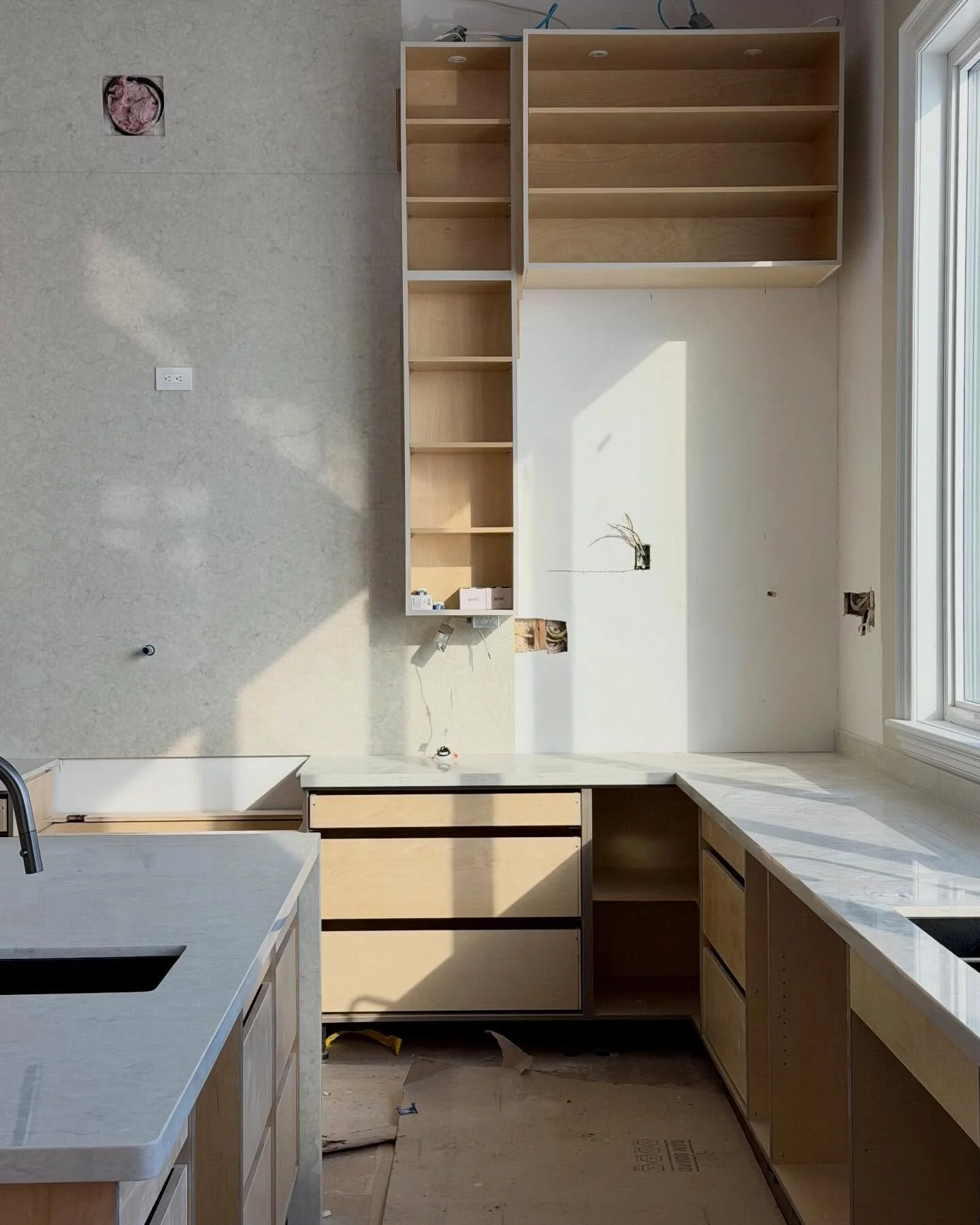 From one of our ongoing custom builds in #Kitchener, this kitchen is beginning to take shape with solid wood cabinetry, a full-height quartz backsplash, and 11-foot ceilings that open the space with natural light. ✨

#kitchenerontario #kitchenerwater