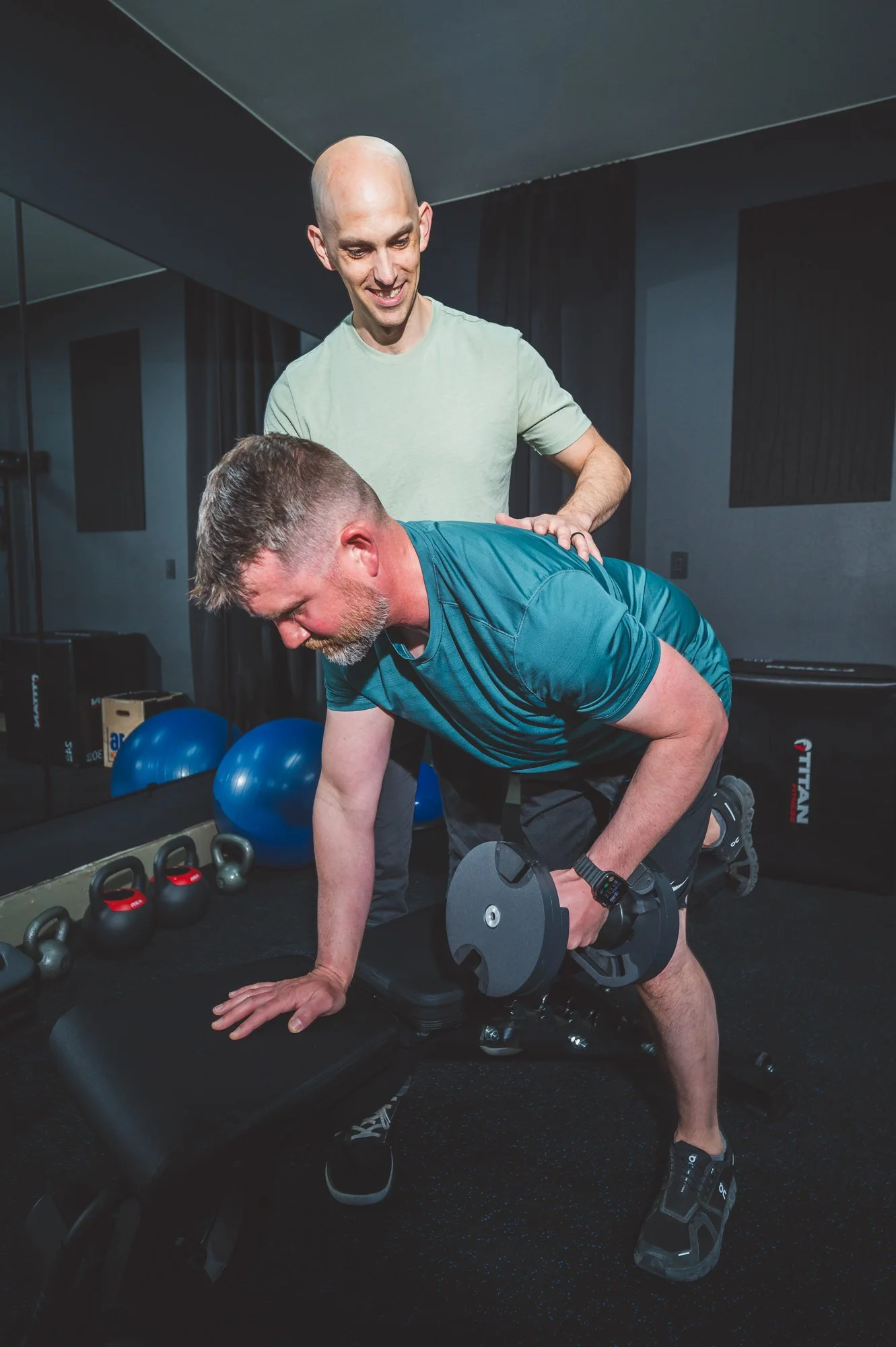 orthopedic physical therapy session with a patient lifting weights