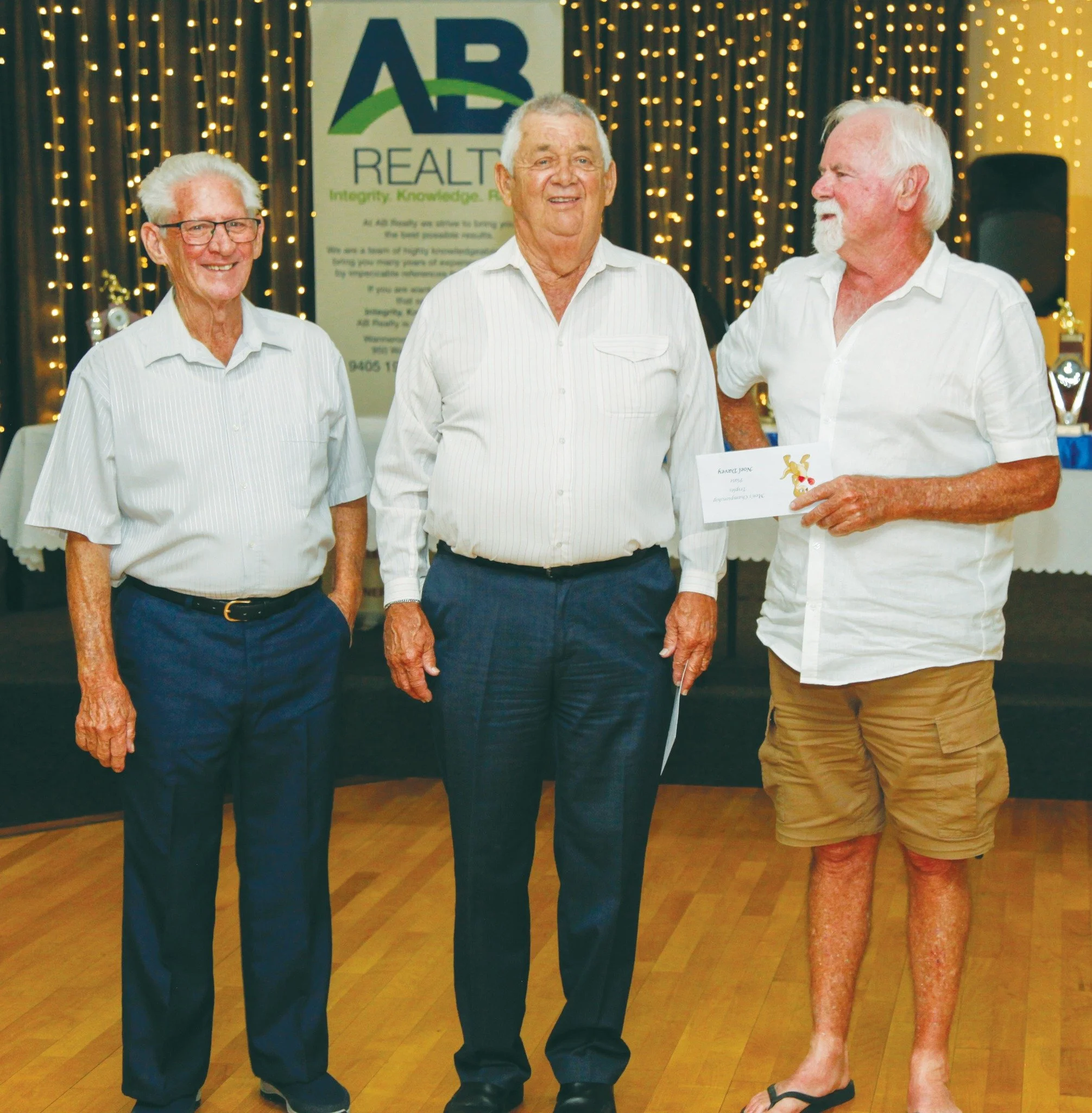 Men's triples Plate winners, John and Noel
