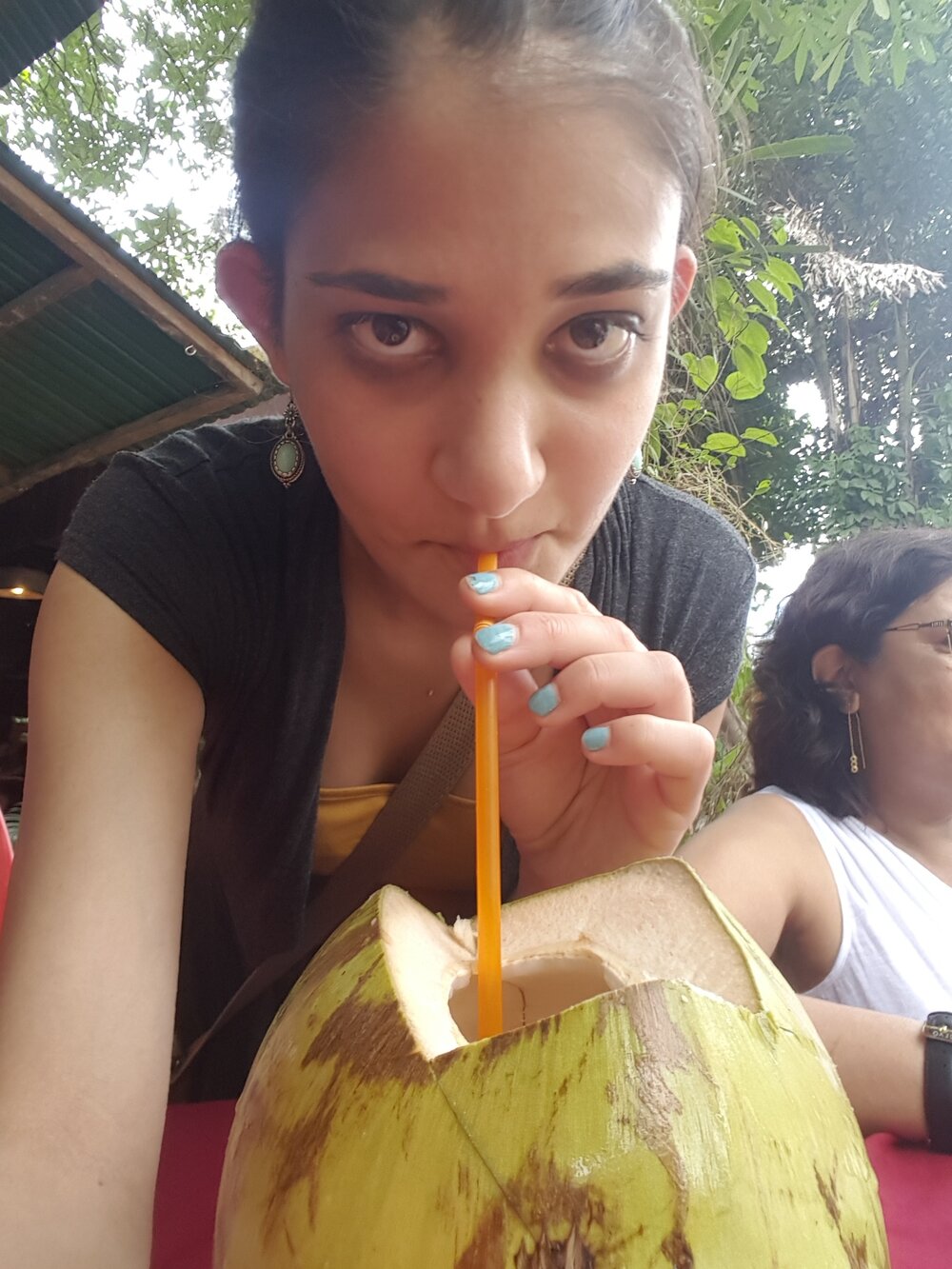 Drinking some coconut water
