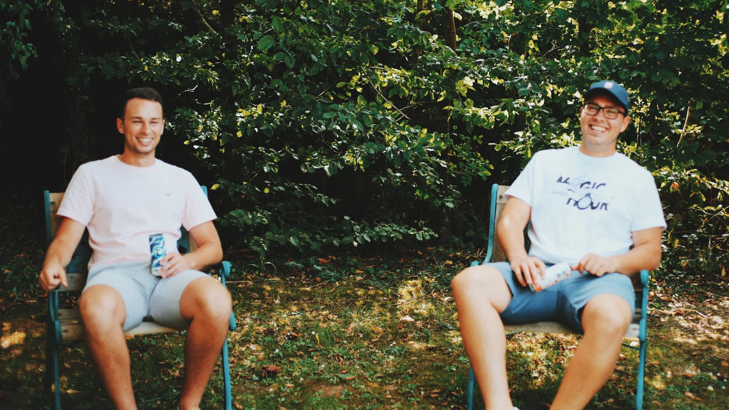 The founders of Arrowtown Drinks are pictured sitting with a can of Arrowtown hard seltzer.