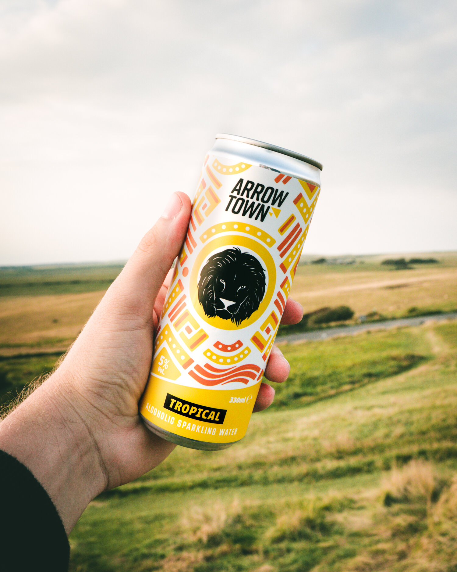 Arrowtown tropical hard seltzer pictured in front of the Sussex Downs