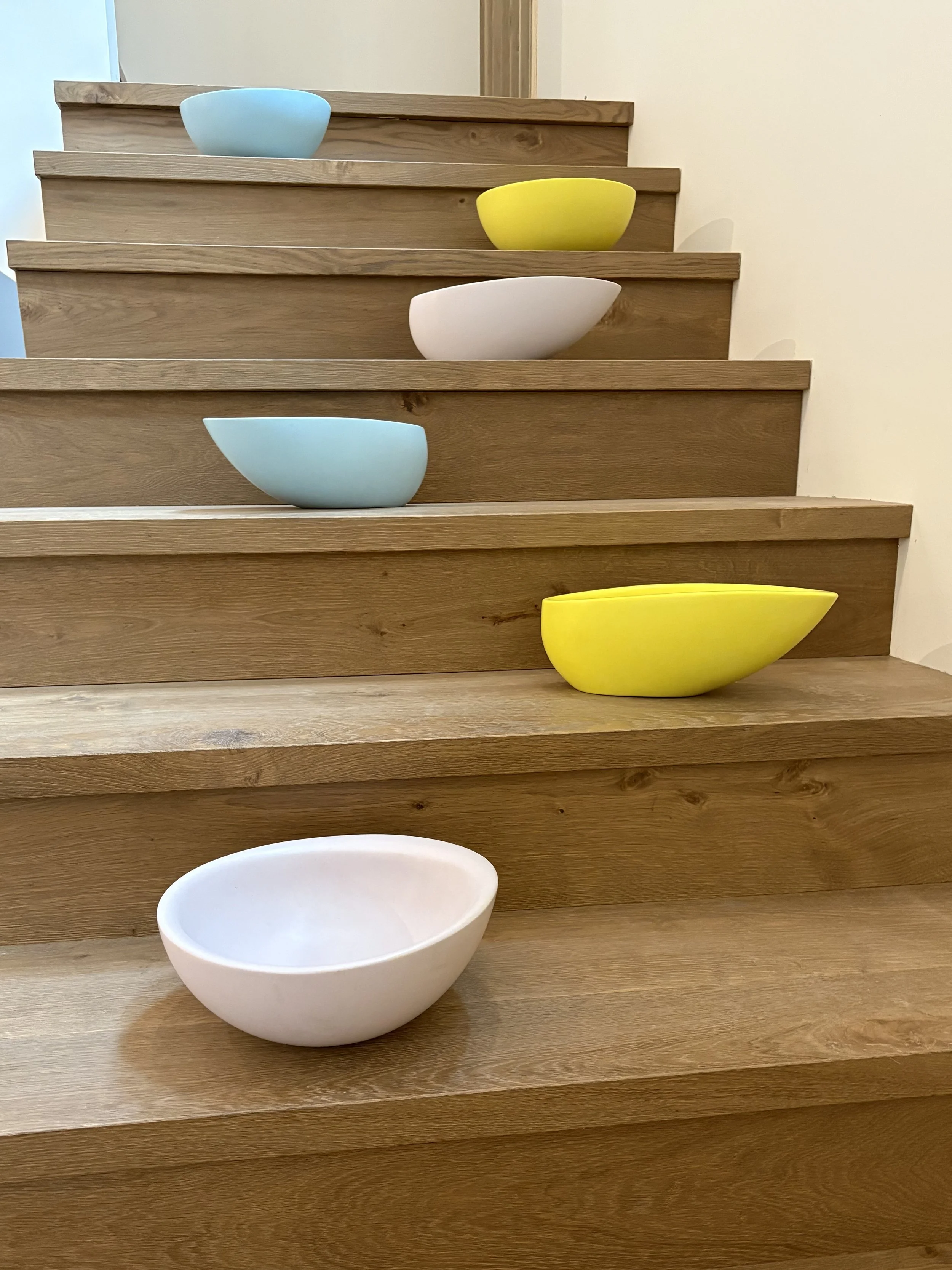 6 mini tubs (smaller versions of the full size tubs) displayed on a staircase