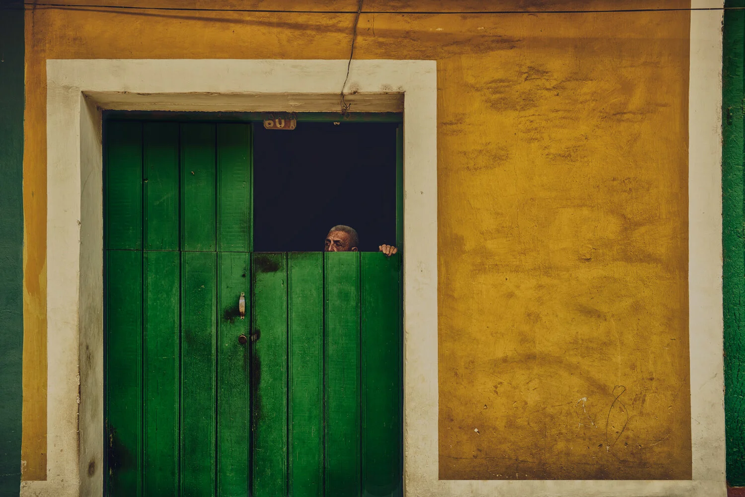 CUBA-MAN-GREEN-DOOR.jpg