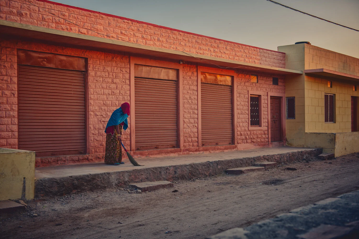 LONE-WOMAN-SWEEP.jpg
