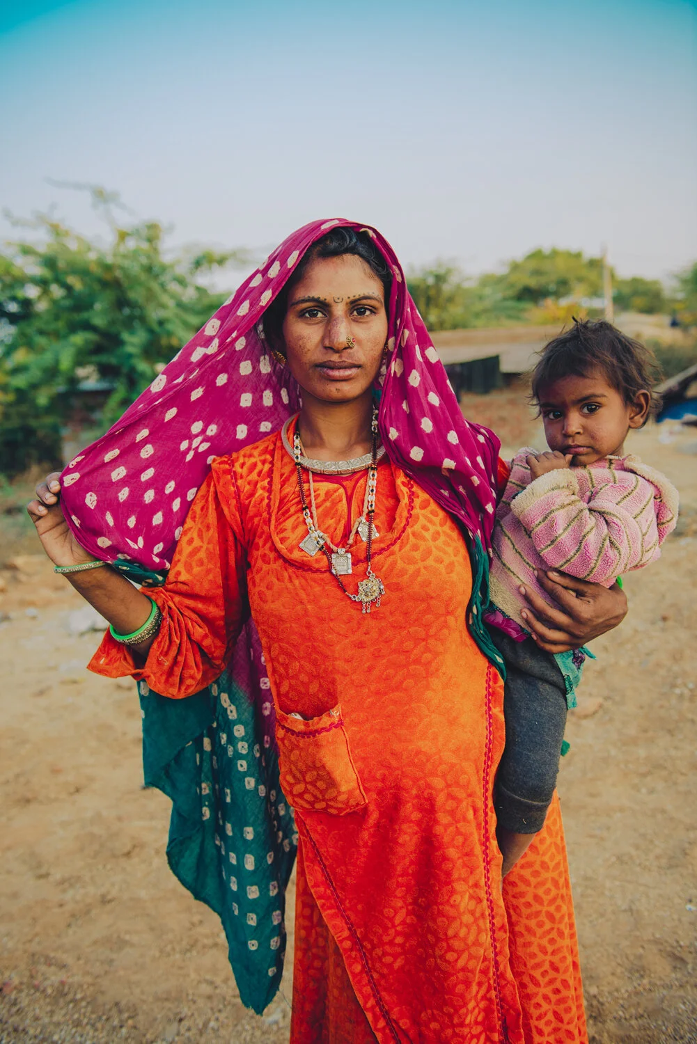ORANGE-WOMAN-WITH-BABY.jpg