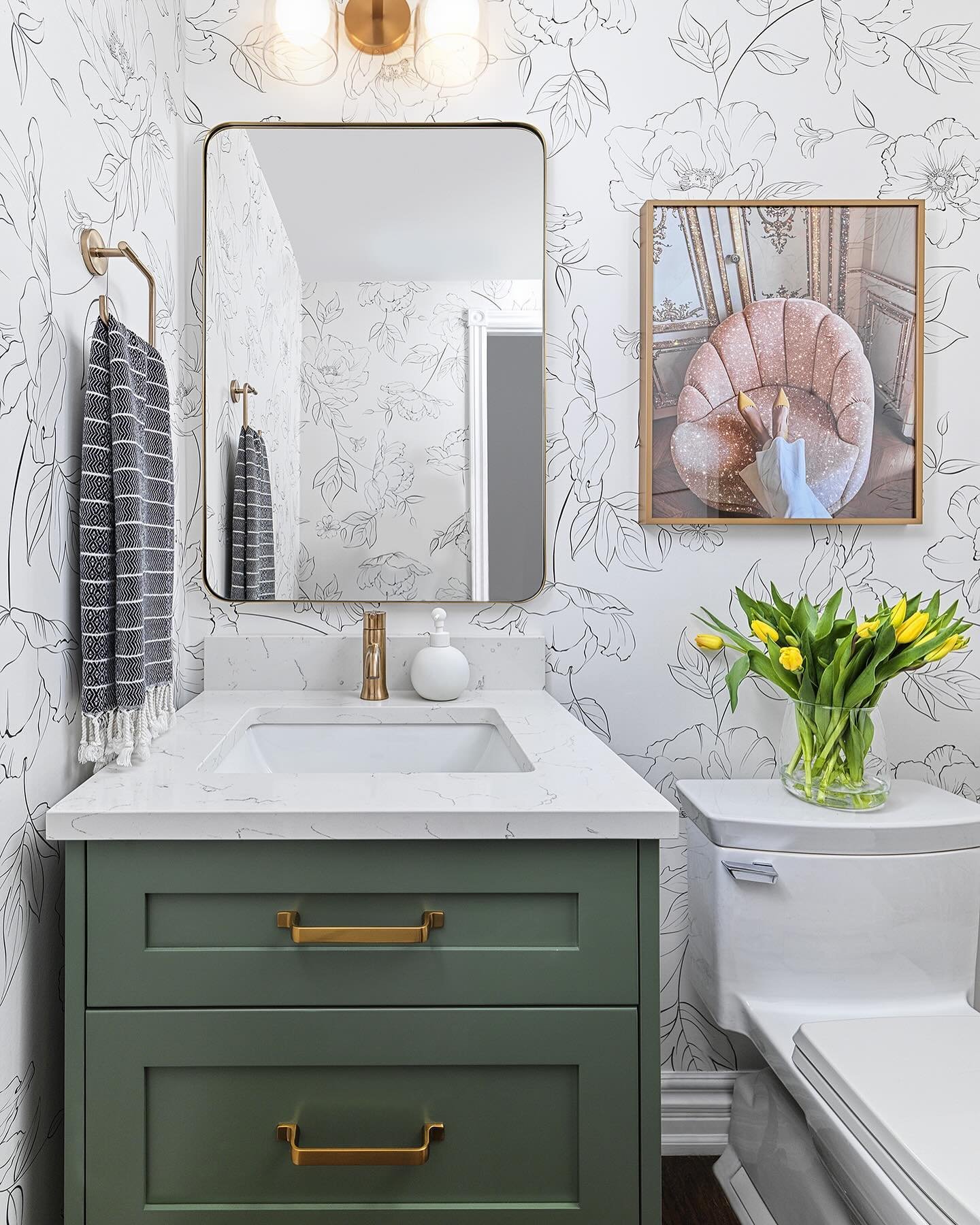 Loving the fresh pop of green from the vanity, complemented by the timeless elegance of black and white wallpaper. And of course, no space is complete without a touch of art to elevate the vibe!

📸 @arnalphotography 

#powderroomdesign #wallpaper #g