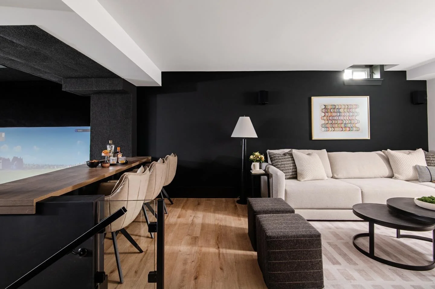 More shots from our basement renovation: a cozy family room, a custom bar, and perfect views of our golf simulator.
Next up&hellip; the hockey shooting area and our steam/sauna setup.
We packed a lot into this space 🤍

@steptoecarpentry 
📸 @mike_ch
