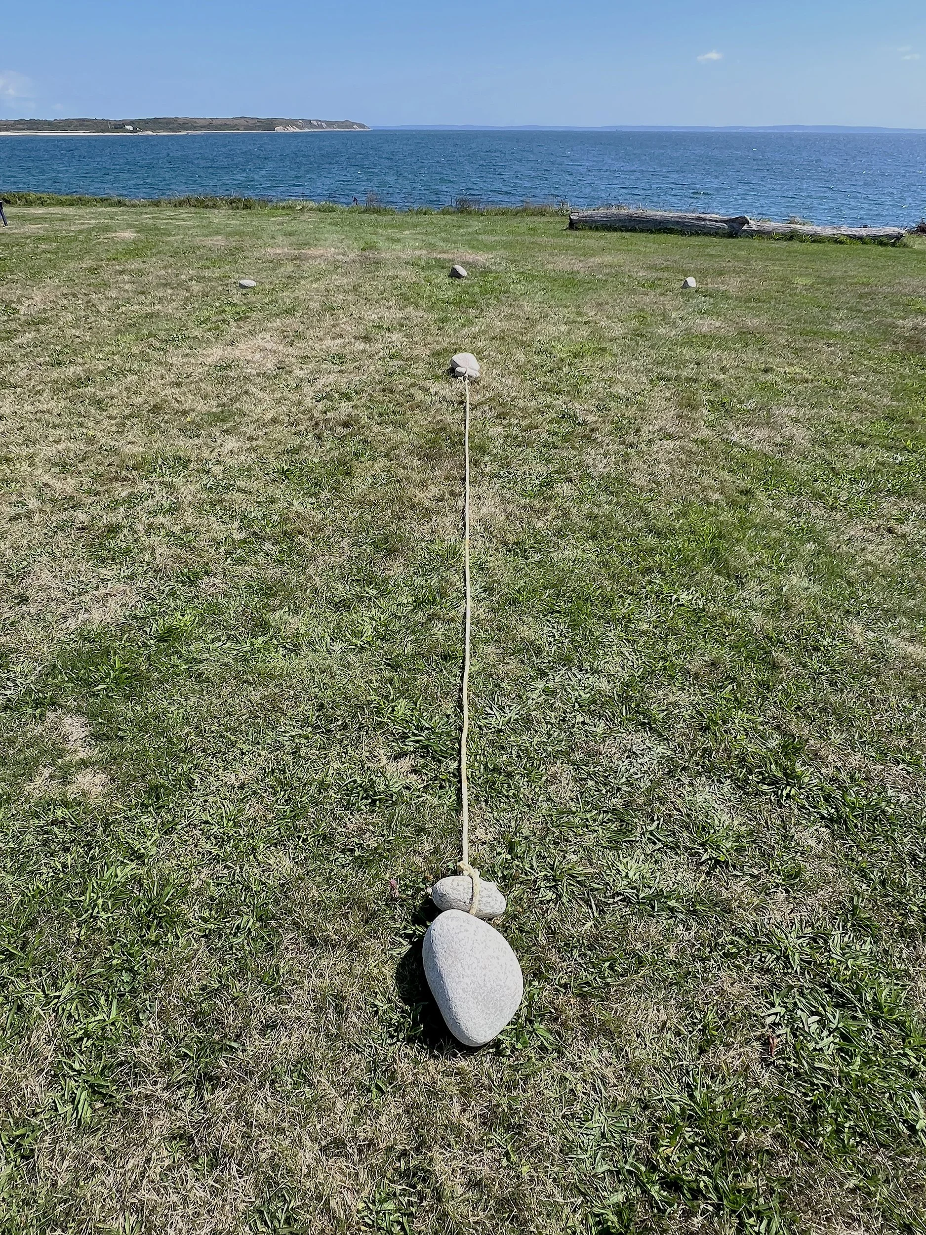 Laying out the subsequent stones facing due east.