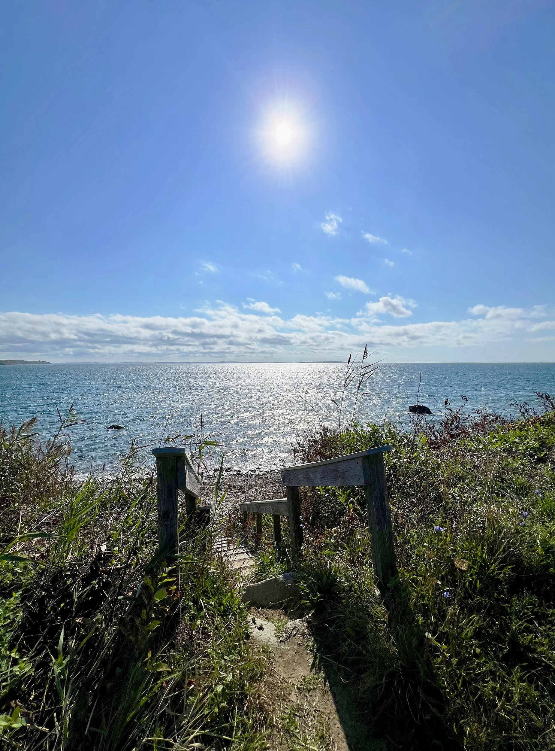 Ramp down to the beach, facing the rising sun in the east.